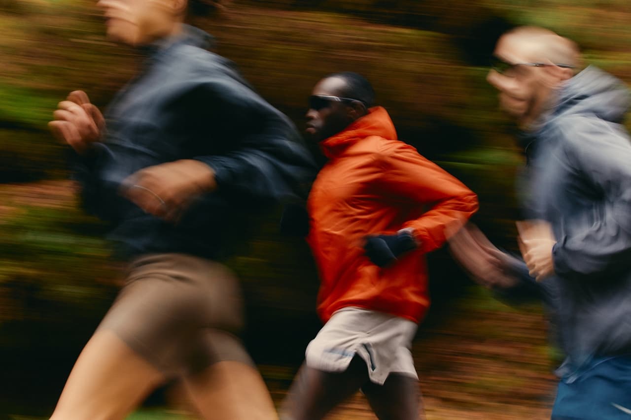 Three runners in motion blur on a forest trail