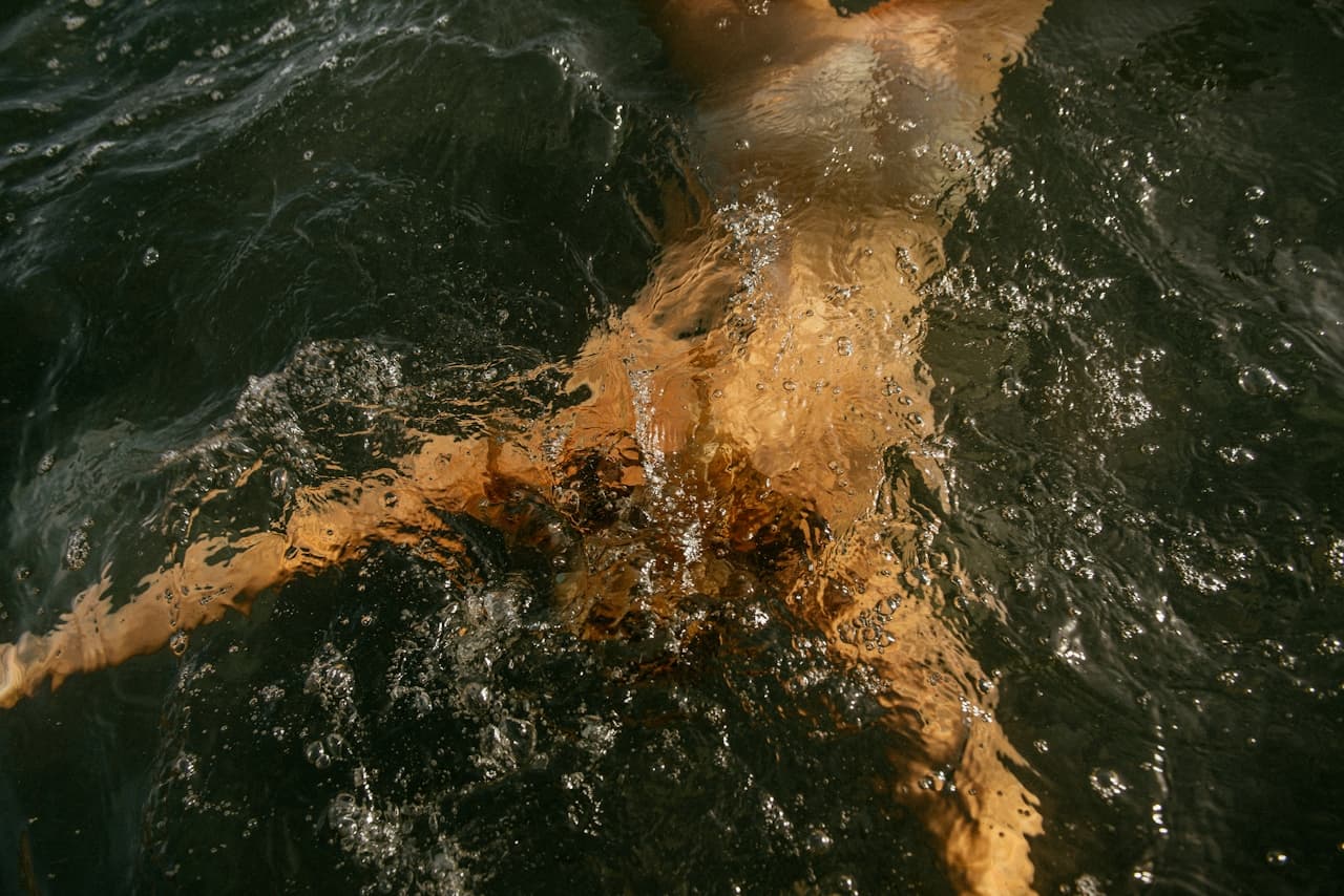 Open-water swimmer cutting through the water